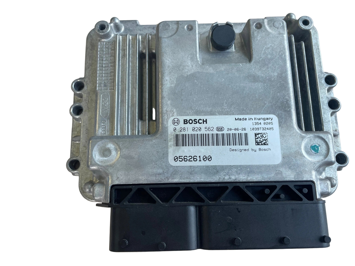 A Bosch automotive electronic control module ECUsensor, featuring a silver metal casing with a white label and a black connector plug at the bottom, photographed on a light beige textured surface.Bosch Engine ECU ECM 0281020562 for Hatz 3H50TICD Diesel Engine – NEW
