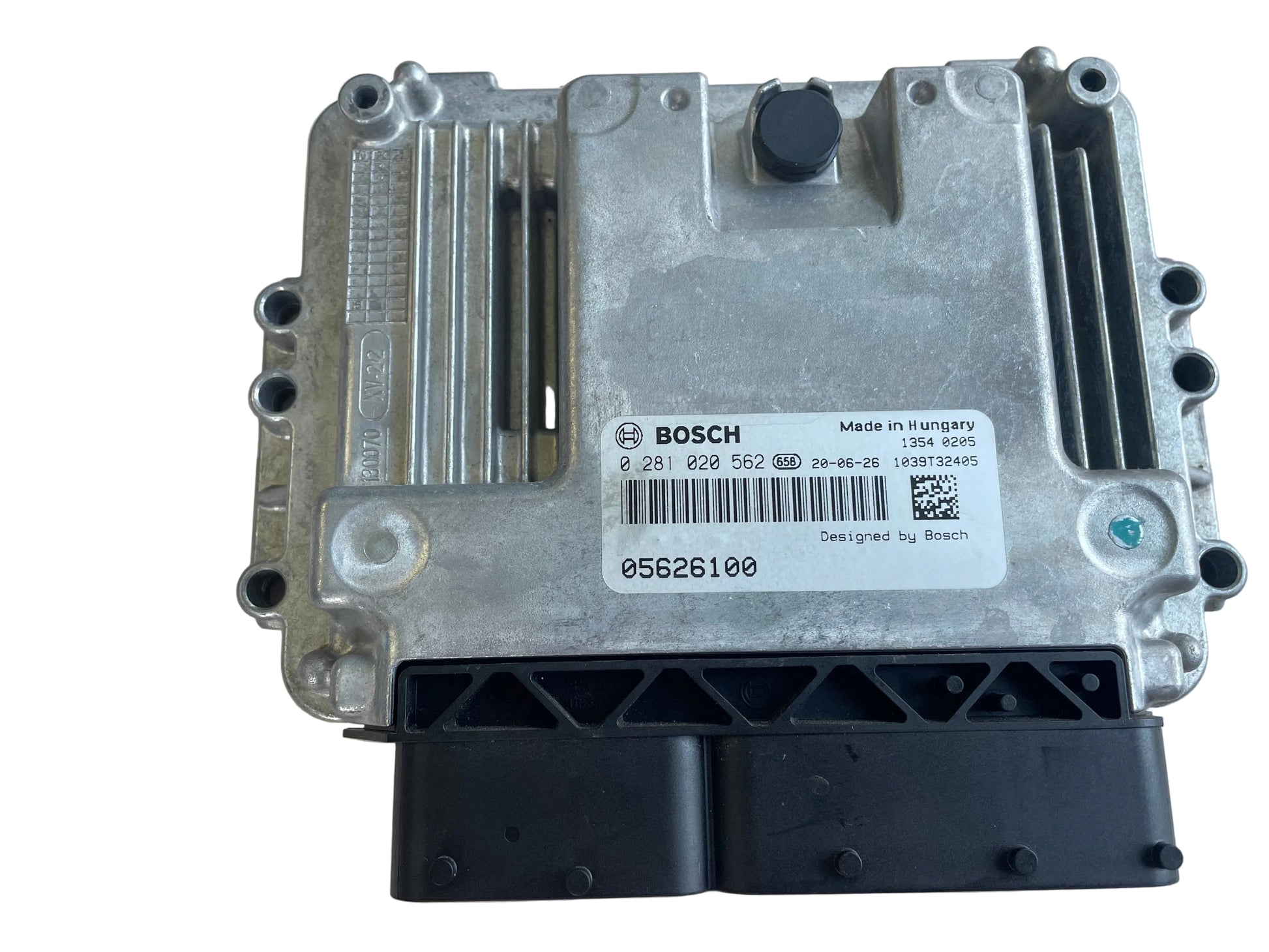 A Bosch automotive electronic control module ECUsensor, featuring a silver metal casing with a white label and a black connector plug at the bottom, photographed on a light beige textured surface.Bosch Engine ECU ECM 0281020562 for Hatz 3H50TICD Diesel Engine – NEW